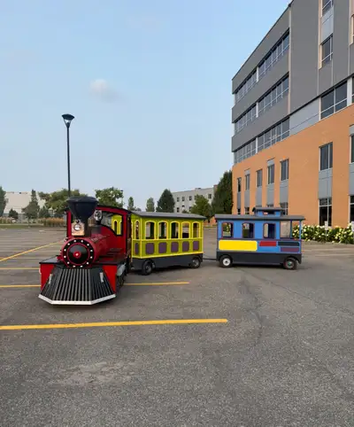 Gas-powered trackless train with passenger wagons for outdoor use. Perfect for flea markets, festiva...