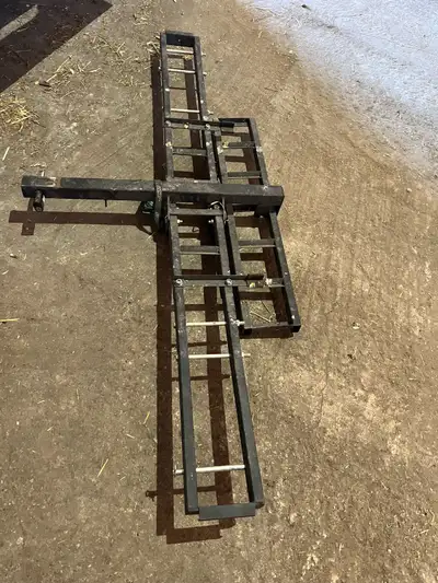 Black powder coated steel. Includes ramp (mounts on carrier for transportation). Up to 500 lbs capac...