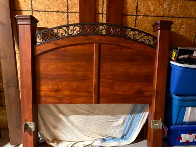 Solid wood , Decorative wrought iron on top. Nice piece of furniture