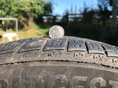 Bridgestone winter tires on rims. Plenty of tread left. 215/50/R17.