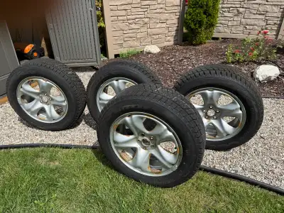 Bridgestone Blizzak tires on rims. Tire size is 225/60R17. Came off a Subaru Forester, used for one...