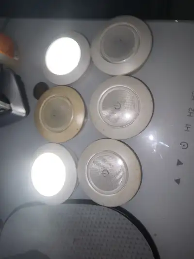 Six -Under-cabinet or in cupboard puck battery lights, View more