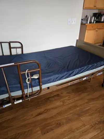 This is a used Invacare Solace hospital bed, perfect for home care or medical facilities, featuring...