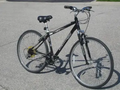 BARELY USED 700C SCHWINN HYBRID SERIES 24 SPD WITH SUSPENSION!, View more