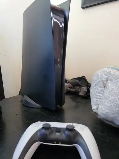 Back Playstation 5 disk drive , 1 tb , with power cord and controller .