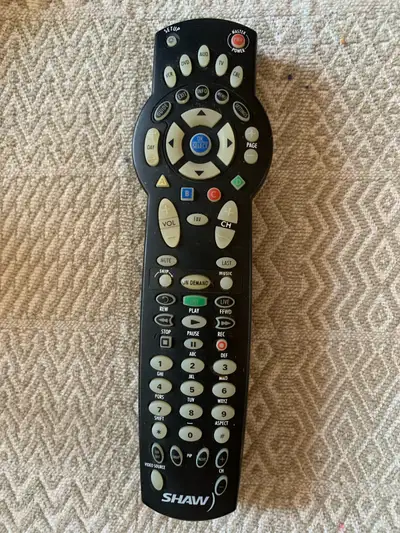 This is a used Shaw remote control that's in good working condition. It has all the standard functio...