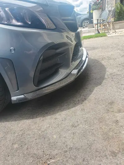 Real carbon fiber front splitter. Fits face lift model W205 with AMG bumper. Was on a 2019 C43. Spli...