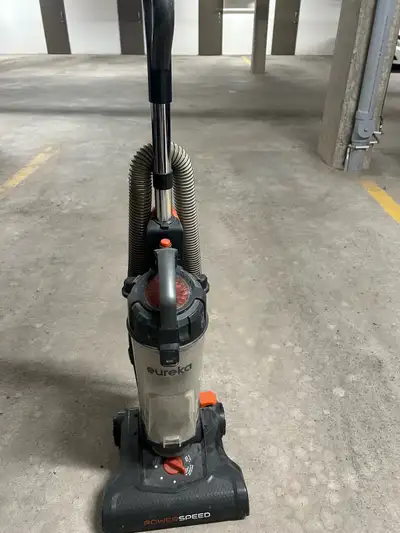 Eureka upright vacuum. Has hose but no attachments. Excellent for carpet and bare floor. Call or tex...