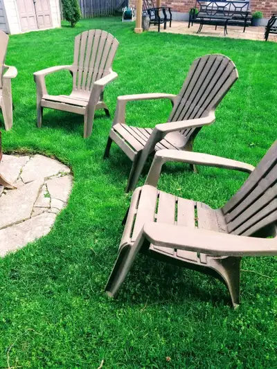 Get ready to relax with these comfortable and stylish plastic Adirondack chairs, perfect for any pat...