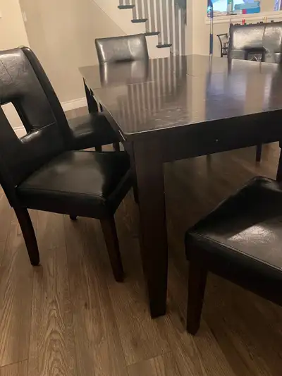 Dark Brown Table: height 30 1/4” width 41 3/5” length 78” Chairs- 6 back rest height 38 1/2” width-...