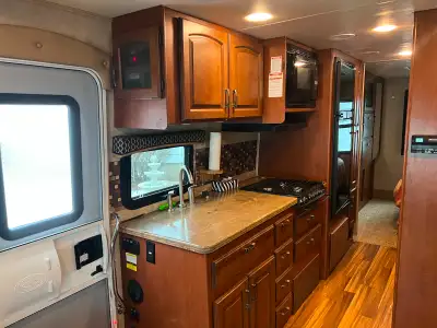 Ford 6.8 L V 10 gasoline engine. 42,900 miles, 2 slide outs with toppers, power awning with LED ligh...