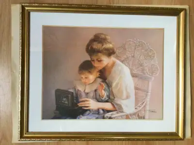 It is a very nice wall hanging decoration, a framed print of a mother and a child playing by Jennie...