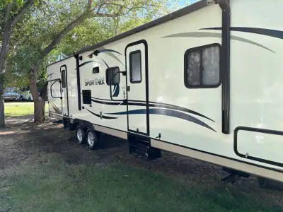 Well‑maintained 2014 Venture SportTrek 322VBH travel trailer, perfect for family camping. This unit...