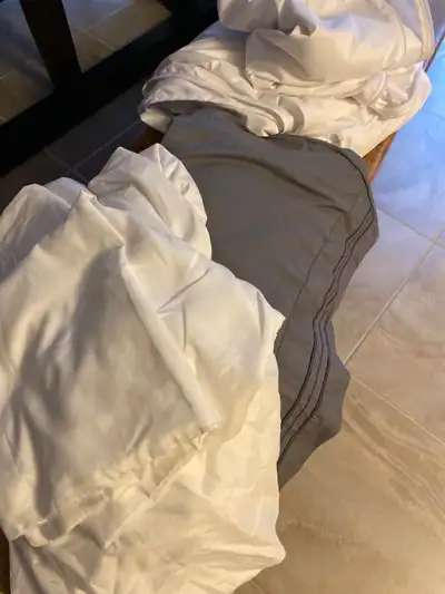 One white and one gray and white bed cover University beds ex large