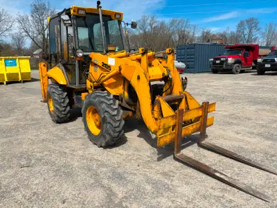 JCB210S loader backhoe runs well with quick detach clamshell bucket, forks, and snow plow. Down rigg...