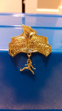 Gold plastic Power Rangers badge/clip/brooch