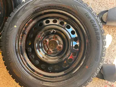 4 Yokohama ice guard tires on steel rims with Tire pressure monitors and wheel covers ; 205/60R16 Us...