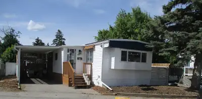 Welcome to 40 Silver Birch Way NW in Greenwood Village. This RECENTLY UPDATED home is located on a q...