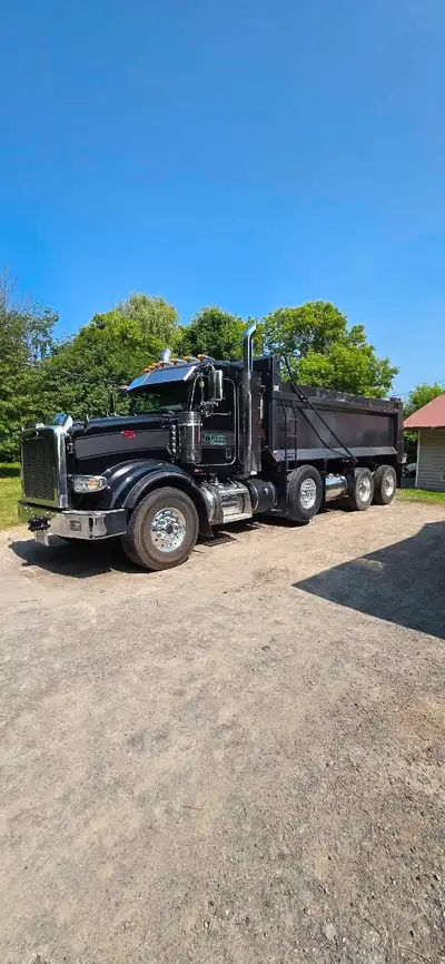 OWNER OPERATED 2021 Peterbilt spif triaxle dump truck. Bibeau box with high lift air gate and 2 coal...