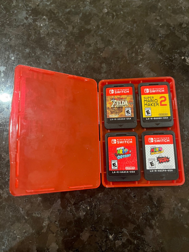Nintendo Switch 4 Game Bundle Cartridges + Case in Other in Ottawa