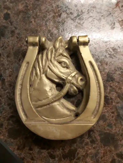 Heavy metal horse door knocker., View more