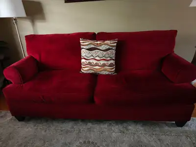 These cozy red velvet loveseat and sofa are in good condition and ready to add a pop of color to you...