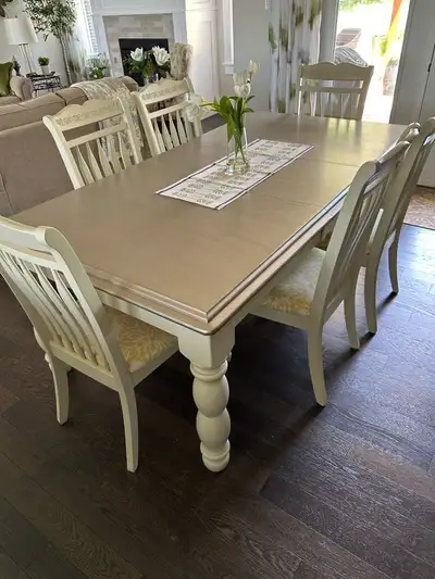 Farmhouse table 78” long x 43” wide x 30” high. 6 chairs covered in a custom fabric.
