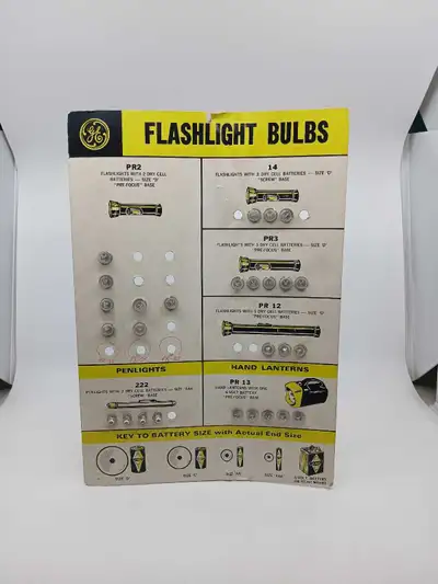 This is a vintage General Electric (GE) Flashlight Bulbs store display card designed to help custome...