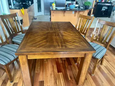 Solid wood table with leaf and 8 chairs in excellent condition. Chairs were all recently recovered....