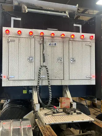 Three door enclosed headache rack with lights. And U Bolts will be off the truck this week.