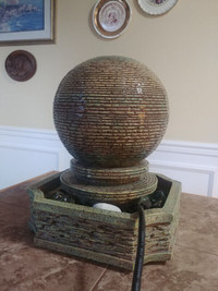 Globe shaped water fountain