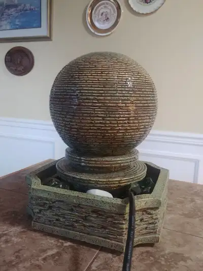 Globe shaped water fountain, View more