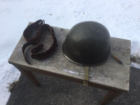 WW2 US M1 helmet and a leather US military issue belt