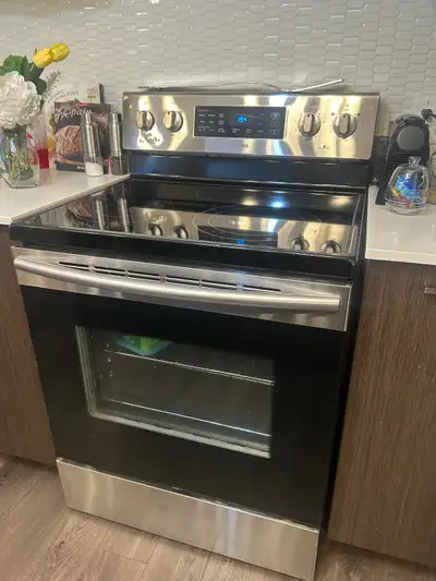 Frigidaire and stove washer dryer like new, View more