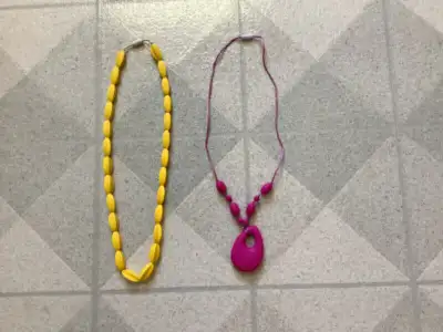 Soft chewable teething necklace for Moms to wear and Babies to chew, touch and tug. Soft silicone be...