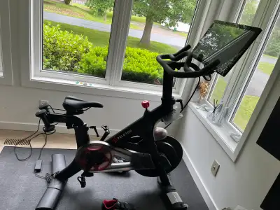 Like new Peloton bike. Rarely used. 2 pairs of shoes size 40 and 46 in great shape. Comes with mat a...