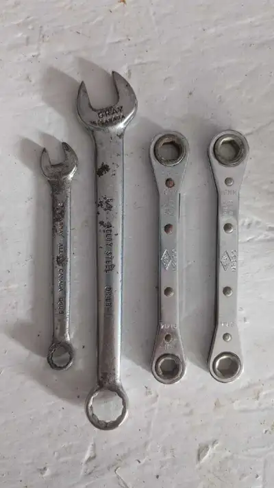 Set of wrenches and ratchets. Made of alloy steel. Gray Canada marked on tools. The ratchets say Mad...