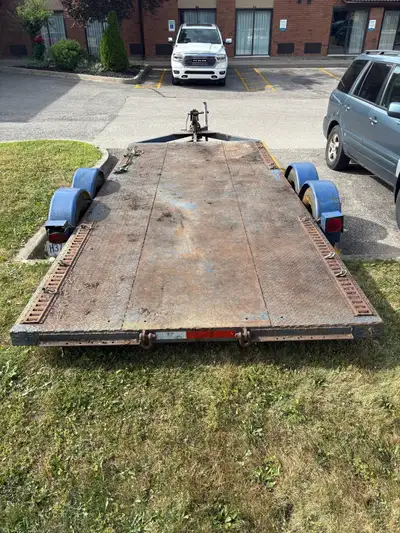 Older home made trailer but it’s solid . Dual axle , steel deck . Deck dimensions are 16 feet long a...