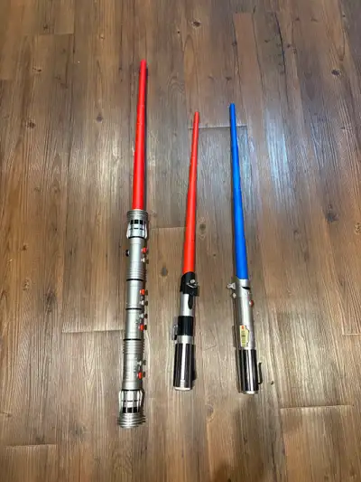 Retractable light sabers, two red and one blue.