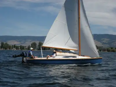 Own a piece of sailing history. This handcrafted 1953 Jollenkreuzer 15er is a rare find—21 feet of e...