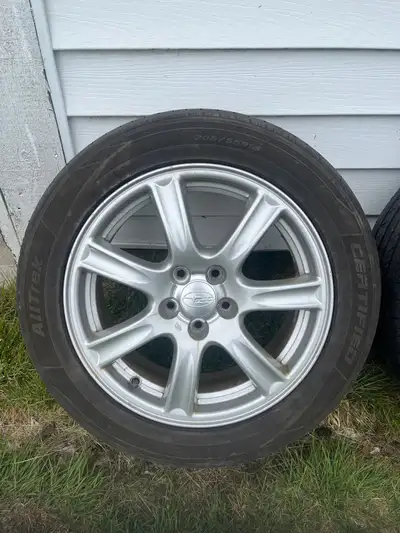 4 all-season 205 55 16 tires installed and balanced on Subaru rims 5-100 (Impreza). Rims aren’t imma...
