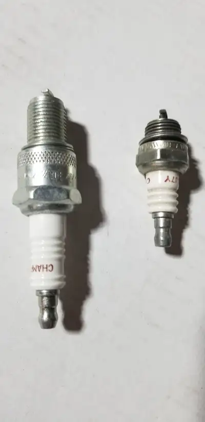 2 Champion Spark Plugs 1 - Size 353 and 1 - Size N5 In Good Condition Selling for $2 each