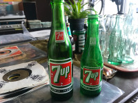 2 vintage 7-up pop bottles in top condition