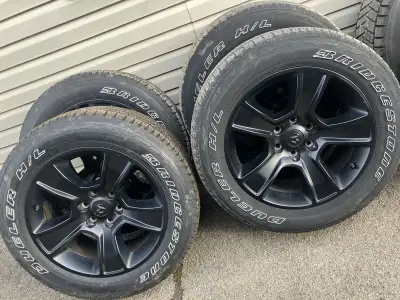 4 Black 20 inch wheels with tires off a 2023 Dodge ram 1500 6 bolt rims in great shape no curb rash...