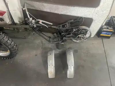 1975-80 Yamaha Gt 80 frame with foot pegs , sprocket , rear rim , handle bars kick stand , two rear...
