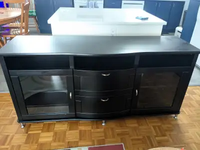 Black IKEA TV stand in well maintained shape. Room for audio equipment, books, photo albums, etc. Sp...