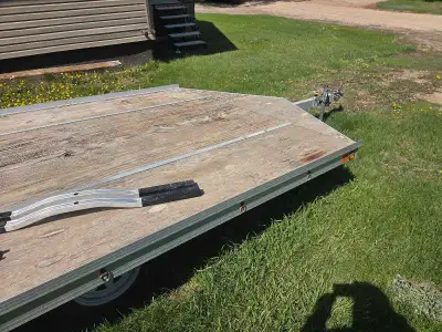 2 place sled trailer. Aluminum frame. Ramp for loading. Spare tire. 2" ball.