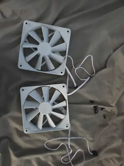 These are two used NZXT white fans, perfect for adding some cool and quiet airflow to your computer...