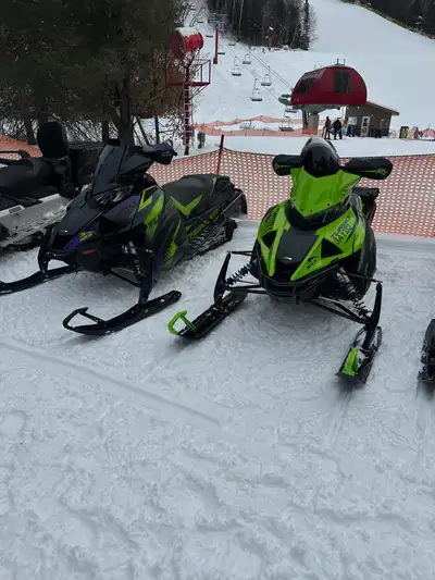 Experience peak performance with this 2023 Arctic Cat Thundercat, a powerful trail snowmobile featur...