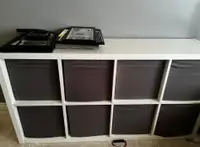 One black shelf and a blank white shelf comes without bins